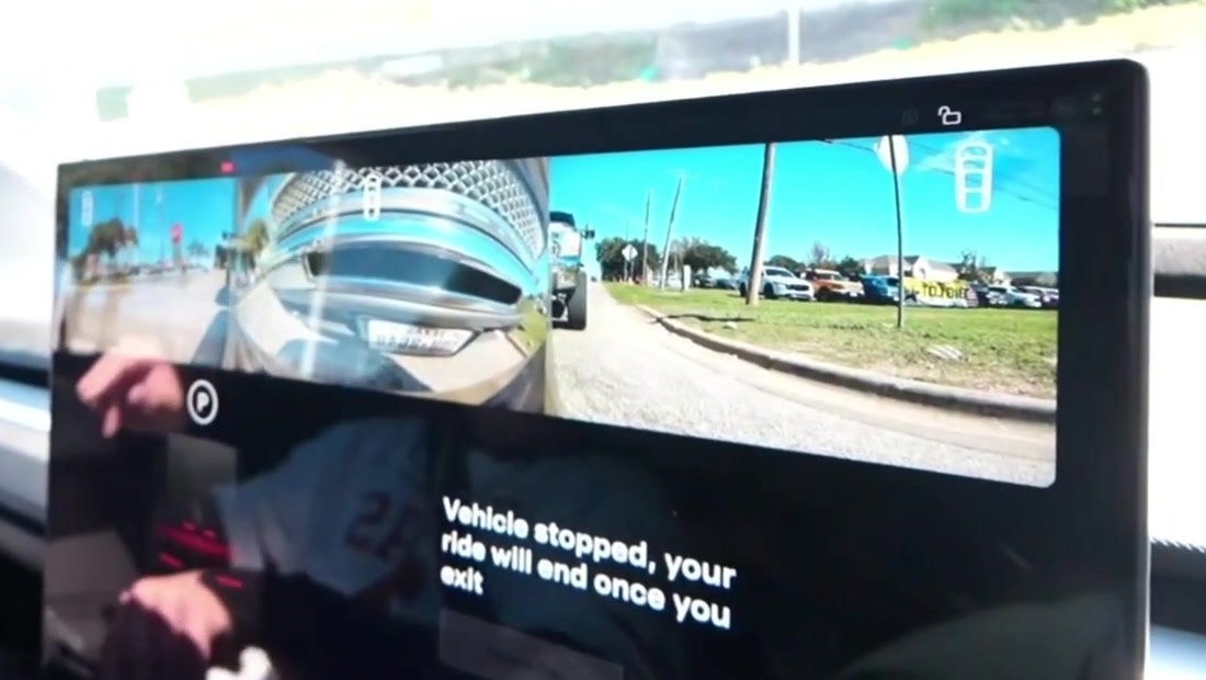 Seconds after the impact, the Cybercab's screen shows the truck behind it and the message "Vehicle stopped, your ride will end once you exit." Frame from Sketch's Twitch stream via @butala_aryan / X