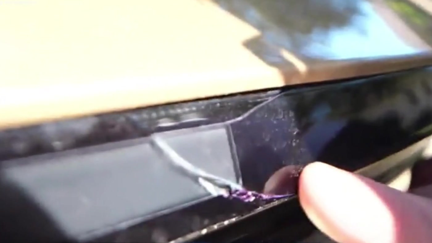 The damage: a small crack in the black trim along the Cybercab's rear light bar. Frame from Sketch's Twitch stream via @butala_aryan / X
