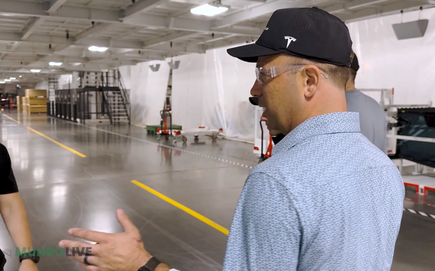 Lars Moravy on the Cybercab production floor during the Munro Live walkthrough. Image via @SawyerMerritt / X