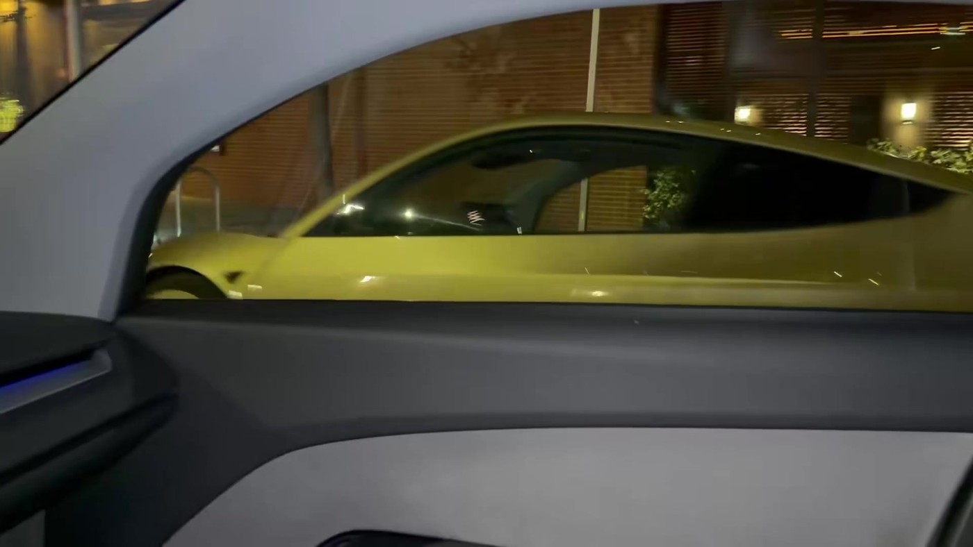 One Cybercab passes another late on Wednesday. Video still via @TitaniumTomP / X