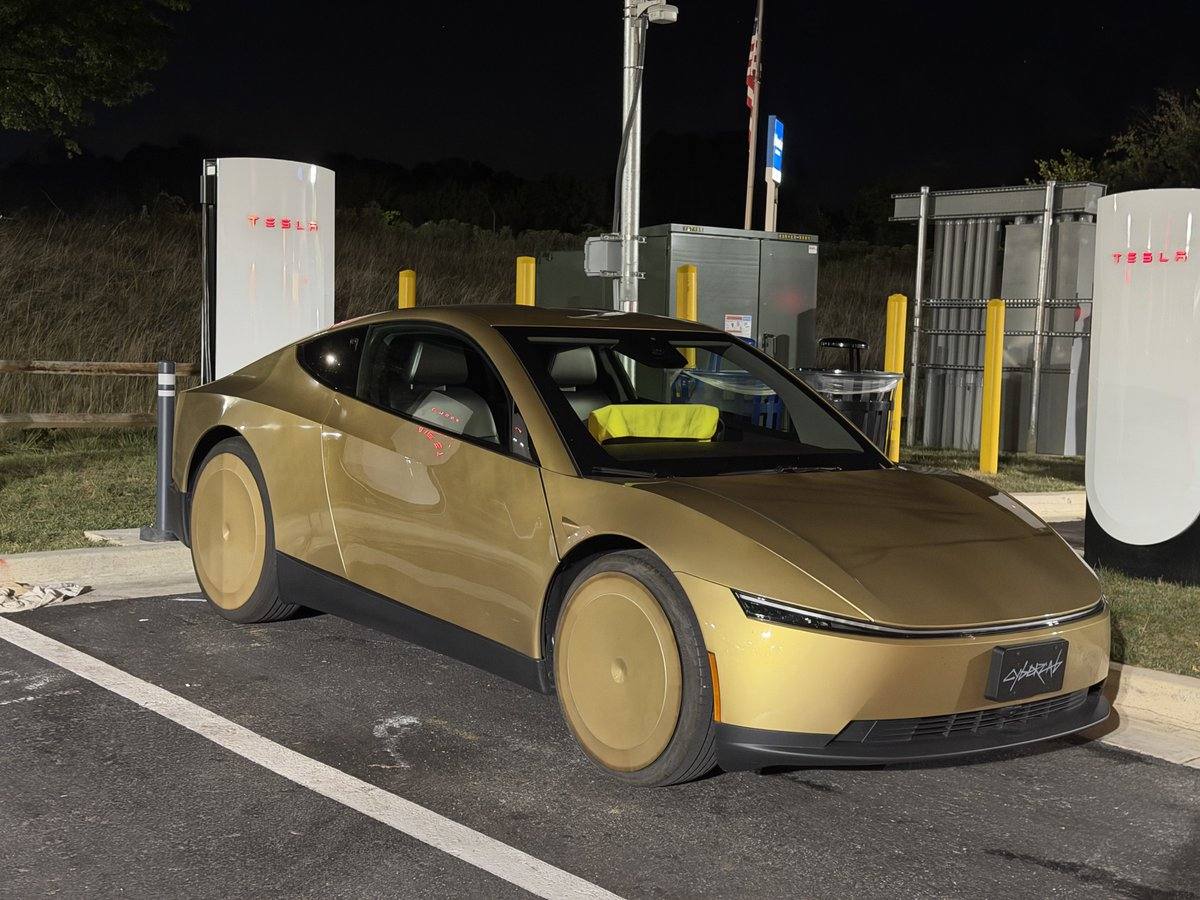 A gold Tesla Cybercab at a Supercharger bay in Greenbelt, Md., on Tuesday night.