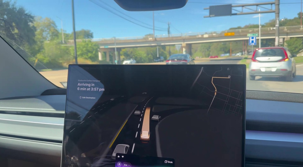 Daytime Cybercab cabin with Grok active on the center screen during a Starbucks trip. Still via @BLKMDL3 / X