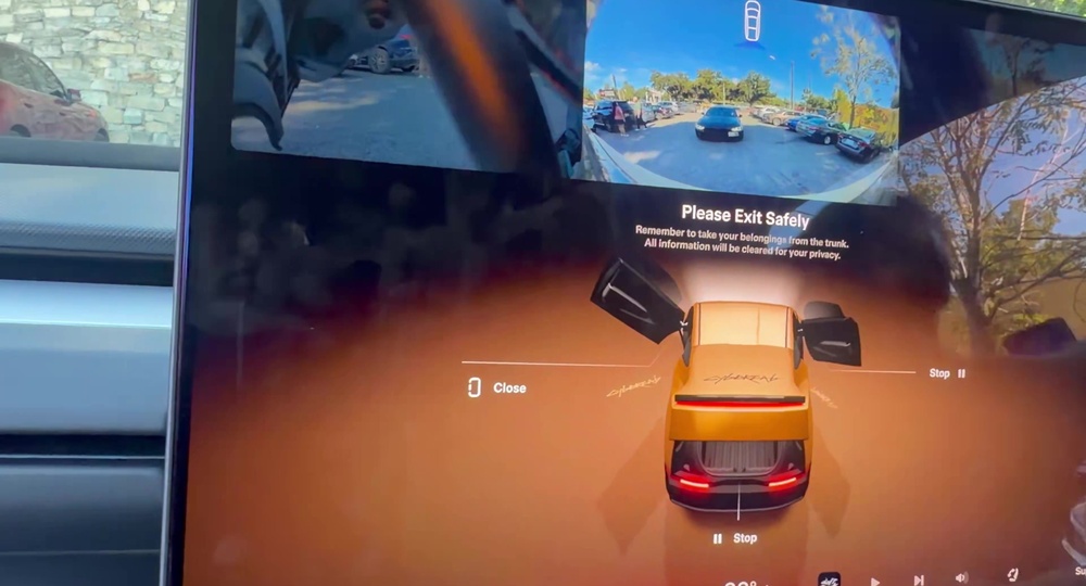 Exit screen reminding the rider to take belongings from the trunk, with the hatch shown open on the 3D Cybercab graphic. Still via @BLKMDL3 / X
