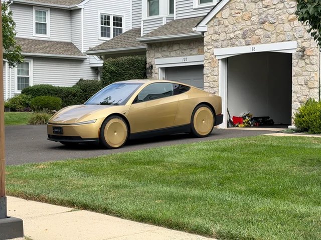 Gold Cybercab on a residential driveway in Northridge, Calif.