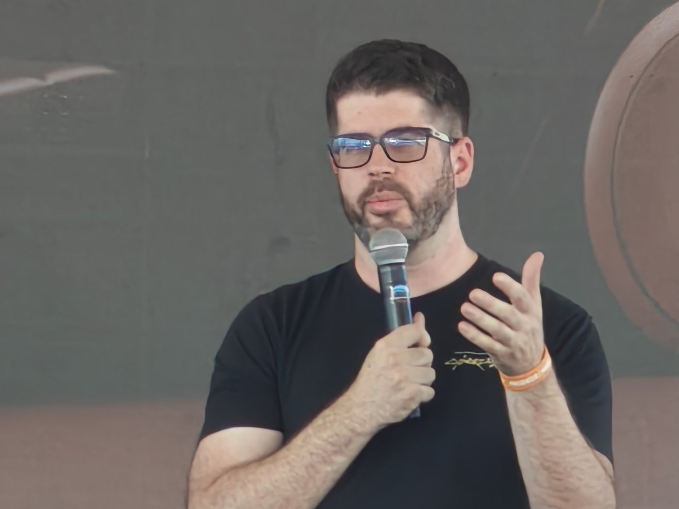 Cybercab chief engineer Eric Earley on stage at X Takeover, Giga Texas, on Saturday. Photo via @teslawelt / X