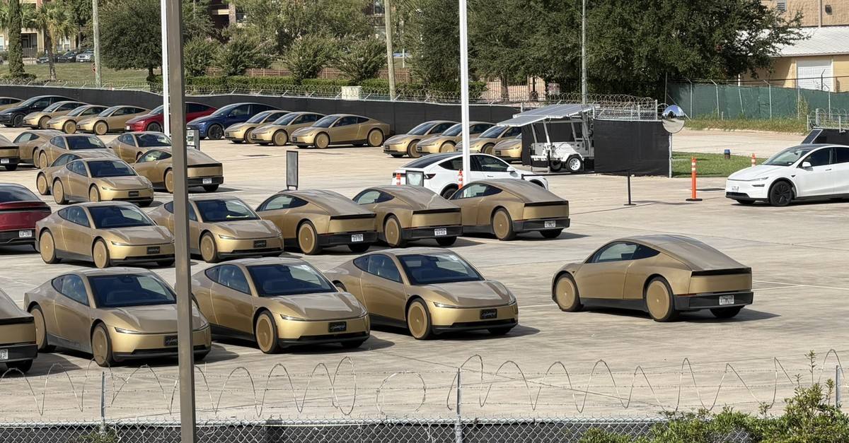 Gold Cybercabs staged in a fleet lot.