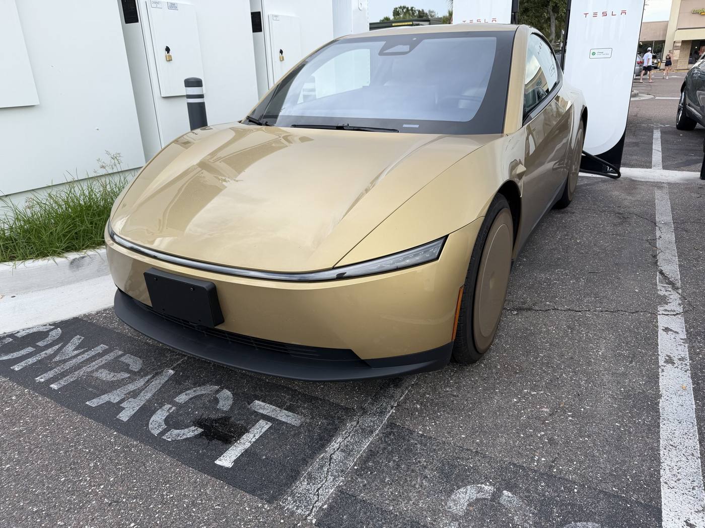 Gold Cybercab on a Tampa Supercharger stall in Florida.